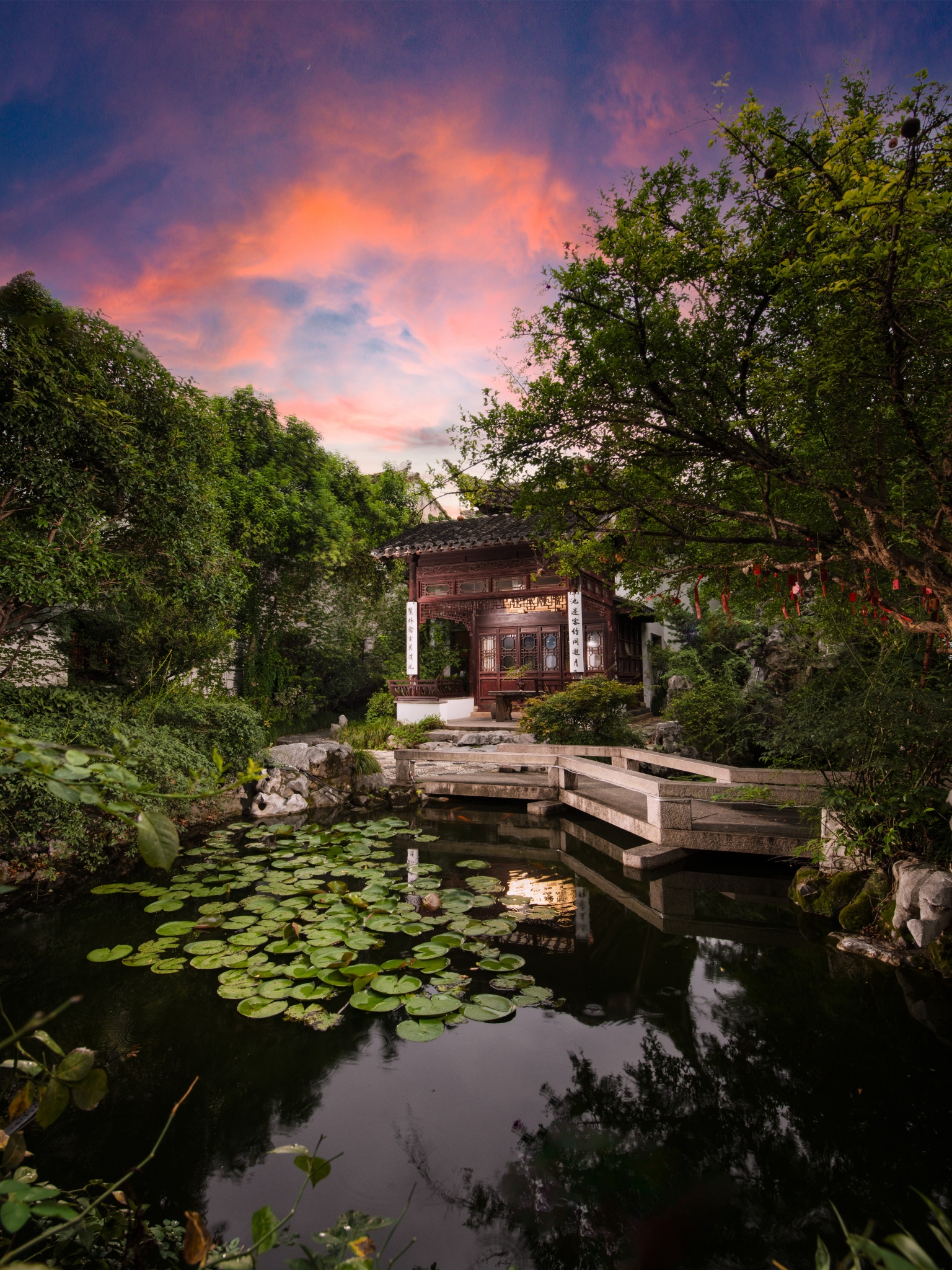 Lotus pond and garden pavilion at Blossom House Suzhou Tanhuafu